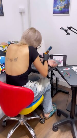 Jessica Pasaphan Instagram - Do what I love 💙🤍🖤🧡🩵 #jjptattoo