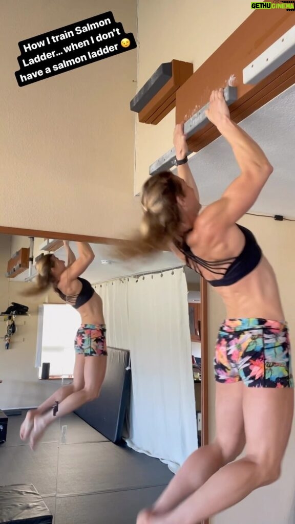 Jessie Graff Instagram - How do you train #salmonladder (and other dynamic kipping obstacles) when you don’t have an actual salmon ladder? I like to do sets of locked off kipping pull ups. What would you call these? Cliffhangers by @atomikclimbingholds Shorts by @constantly_varied_gear #ninjawarrior #ninjatraining #homeninjatraining #salmonladderdrills #kippingpullups