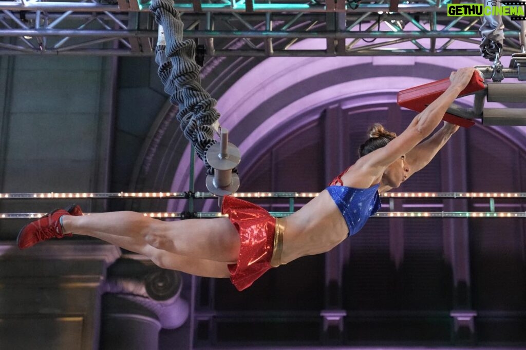 Jessie Graff Instagram - So grateful to be back competing on @ninjawarrior ! And this time, with my mom @ginnymaccoll !!! If you haven’t seen last week’s episode yet, spoiler alerts! Go catch up now! Win: this was the first time I’ve made it to the 5th obstacle without feeling even a little pumped! My grip was so fresh and ready! Room for growth: I had a unique strategy that no one else had tried, which had the potential to save me time and energy. Rather than hold a left hand lockoff, while trying to turn the cube with the thin ledges on the front side, i planned to swing forward and grab any one of the three large jugs on the right side of the cube. My big mistake was not choosing which one to reach for and aiming precisely. I swatted between two jugs and missed both. If i had thought about how (nearly) impossible it would be for me to hold on to a slippery plastic flat ledge on a one armed back swing, i might not have chosen to take that risk. So in hind sight, I do wish I’d taken the more standard path. But i had so much fun strategizing for this obstacle, and wish i could try it again! Thank you so much #americanninjawarrior for another opportunity to solve puzzles and test my limits! I definitely grew stronger and smarter through this challenge!