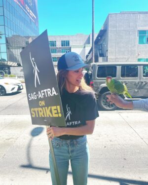 Jessy Schram Instagram - Making Hollywood honk. Day 1 of @sagaftra strikes. Joining the #WGA on their day 74. 
.
Parrots on the picket. Running into friends, costars and writers from now and and way back when. We don’t want to be striking- but absolutely have to. I’ve been a SAG member since 1997. I’ve always felt the protection of my union and feel lucky and proud that it continues to fight to protect me and 159,000  entertainers, to continue making chasing dreams and making a living- safely, financially and respectfully- in this world we call show business.