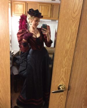 Jessy Schram Instagram - #TB to #LizzieBordenChronicles 🪓🩸First day on set called for a belly dance in a corset while chopping off a paper machete head with red streamers spurting from a dummy’s body. The cast and costumes on this were 🔥🔥and I so very appreciate having played Miss O’keefe.