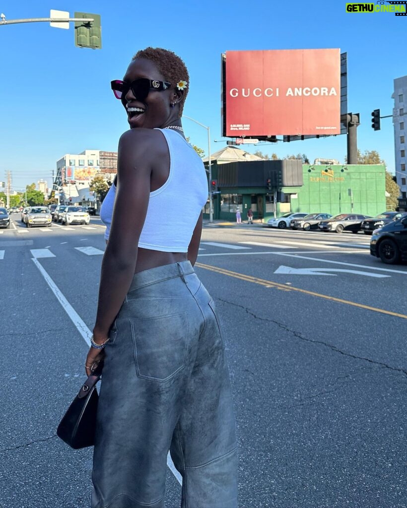 Jodie Turner-Smith Instagram - next stop 🛫🛬📍MILANO! cannot wait to see what you’ve got in store for us @sabatods @gucci 😻❤️‍🔥✨ (swipe to see me trying not to get hit by a car whilst taking a photo with this billboard on sunset blvd milan travel dump)
