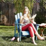 Judy Greer Instagram - Me every year during the Met Gala. Pretending to read a book. Pretending I don’t care that I’ve never been invited. But totally following the red carpet on my phone… #metgala #metgala2024 #gardenoftime #metgalaredcarpet