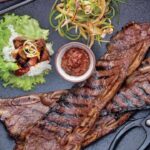 Judy Joo Instagram - Feast your eyes on the Ultimate Korean BBQ Beef Short Ribs (Galbi) 🇰🇷 Galbi is a classic grilled dish that marries Korea’s famed sweet and umami filled soy based marinade with the savoury smokiness of a charcoal grill. The two techniques create a bbq dish you won’t forget and the family will love. 🥩🔥 Elevate your Galbi with these tips: Choose bone-in LA Galbi cut short ribs or trimmed boneless rib-eye steak for a succulent dish. Use Asian or ripe pears in your marinade for an authentic Korean sweetness. Fresh ginger and garlic bring aromatic nuances you won’t want to miss. Dark brown sugar adds a richer, complex sweetness. Roasted sesame oil imparts a nutty, toasty character. Marinate the beef for at least 2 hours, or better yet, overnight, for the deepest flavours. Serve with red or green lettuce leaves, perilla leaves, steamed white rice, spicy lettuce wrap sauce (ssamjang), spicy scallion salad, and kimchi for the complete Korean BBQ experience. And remember, you can always adapt your Galbi using local ingredients you love and have available! Head to the link in my bio for full ingredients and instructions, or visit Judyjoo.com 🙌 • • • • #chef #chefs #cook #cooking #cheflife #chefsofinstagram #foodart #foodblog #foodculture #foodgasm #foodie #foodiegram #foodielife #foodinspiration #foodlover #foodpassion #foodphotography #foodporn #foodstagram #gourmet #instafood #korea #koreanfood #truecooks #beef #beefshortribs #bbq #galbi #koreanbbq #koreanfoodmadesimple