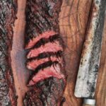 Judy Joo Instagram - I love hanger steak (similar to skirt, and also called butcher’s cut) – a cheaper cut of meat, but full of flavor! This grilled beef pairs beautifully with a refreshing kimchi-apple slaw 🥩🍏. Inspired by traditional Korean Kalbi, this cut is marinated in a mix of soy sauce, garlic, ginger, and sesame oil, and is ready to grill in just fifteen minutes. When you’re grilling, be sure to baste it often for extra deliciousness, char, and color. For the complete method and list of ingredients, click the link in my bio or visit Judyjoo.com 🙌 • • • • #chef #cheflife #koreanfood #fusionfood #grilling #bbq #barbecue #hangersteak #instafood #foodie #recipeoftheday #asianfusion #yum #delicious #homemade #foodlover #foodpassion #foodculture #koreanfusion #korea #korean #koreanfoodmadesimple #judyjoo #chefsofinstagram #beef #steak