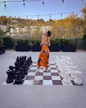 Julia Macchio Instagram - Cobra Kai Season 5 LA Premiere! ❤️‍🔥🍊

The entire season drops tomorrow on Netflix. I found a life size chess board. There’s a massive heat wave. Mercury is about to go into retrograde. Buckle UP. It’s gonna be a wild ride. 

x J