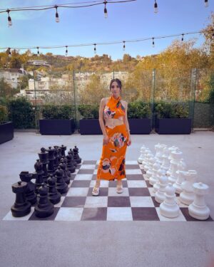 Julia Macchio Instagram - Cobra Kai Season 5 LA Premiere! ❤️‍🔥🍊

The entire season drops tomorrow on Netflix. I found a life size chess board. There’s a massive heat wave. Mercury is about to go into retrograde. Buckle UP. It’s gonna be a wild ride. 

x J