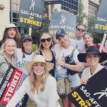Juliana Harkavy Instagram – So empowering and equally surreal suiting up with my Arrow family to picket outside of WB studios yesterday. Thank you to everyone who came out to show your support!! 🏹💚🪧#sagaftrastrike #wgastrike #sagaftrastrong #wgastrong #teamarrow