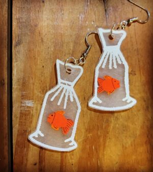 Karen Olivo Instagram - My kid, the amazing @madisonuphoff ,
made these earrings. 😃🧡😃💛😃