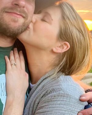 Kassandra Clementi Instagram - I’d firstly like to state that fortunately for my midline and uterus, these pictures are old. 

We got ENGAGED 💍 just over a year ago. Dan was fresh from a rescue covered in goat shit, I was waddling like I swallowed a ford focus, I had also drooled on my shirt during a recent nap, the sunset was beautiful (hallelujah for something nice), it was perfect and perfectly us. 

We’ve said “we should start planning a wedding” and gestured around vaguely at least once a week with no follow through because that bulbous belly is now a giggling, crawling, center of our universe who is better than everyone you know and who has the time.
