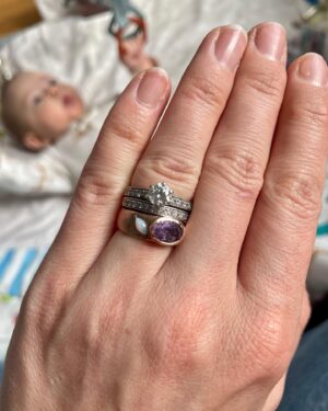Kate Rockwell Instagram - When I found out I was having a baby girl, I immediately thought of having a ring made for her, something she and I could share. 

When I reached out to my friend @vanessaliannejewelry , all I had was the purple stone (from my dad, in honor of my grandmother) and the request that the ring fit with my wedding stack so I could wear it every day until she was old enough to have it. She created the most beautiful, sentimental piece for us, and I’m so thrilled. 

Jewelry has already had significant emotional value for me, and I get teary looking at this piece on my hand, knowing someday it will be on hers. 💜