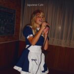 Katelyn Tarver Instagram - When I was a teenager, I had an album I was promoting, and it ended up taking me overseas to Japan to promote it over there. I performed at a bunch of gigs, but one in particular was at a maid cafe where they requested I wear a French maid outfit for the performance. The audience watched while sitting in school desks and the sound system was a boombox with a microphone held up to the speaker. It’s become one of those stories I tell at parties about my weird life as a teenage wannabe popstar, and now it’s the inspiration behind my newest song Japanese Cafe that’s out today. I used to be embarrassed about this time in my life, but writing this song helped me find a new appreciation for the girl in this picture. Thank you @annikabennetttt and @jonnyshorr for helping me take this story and turn it into a song about identity and success and failure and self worth. This song means a lot to me. Hope y’all like it ❤️