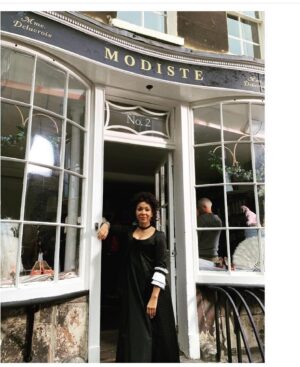 Kathryn Drysdale Instagram - Going to answer some of your questions re Gen here .
1. Why did her shop look different in part 2 season 3 ? 
Thanks to Pen helping boost her business  she upgraded and got a new shop . See before and after 
2.How does she make so many dresses so quickly ?
She has a team of seamstresses who work in the back or from home . She designs the dresses but doesn’t make them all 
3. Why does she always wear the same / similar dress ?The creatives wanted Gen to be have  like a Chanel / Steve jobs / Karl lagerfeld type vibe . Also her job is to make the Ton feel beautiful never to steal the spotlight herself . Sometimes modistes of the time did show off their creations but Genevieve prefers to keep it simple. Her hair in S3 is also always loosely tied up as if in a rush .
4. What happened to her accent in season 3 ? All throughout the 3 seasons Gen actually speaks in her own accent ( london) with people she trusts and when not at work and if she does speak in her accent at work it is usually a whisper or to the side . The French accent is put on to impress the clients who favour Parisian designers . Marina catches her out in season 1 and the first time we see her speaking in her own accent is with Sienna , then Benedict in the club 💙🧵🧵🧵 @bridgertonnetflix @shondaland #bridgerton