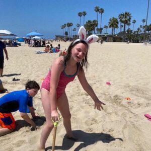 Katie Porter Instagram - We had our first family beach egg hunt today. For those inspired to try this for themselves, I have some tips! 🤓 #easter 

1. No chocolate because it melts. This one I knew! Jelly beans are easy to clean sand from, just in case. As my son Paul pointed out, so are dollar bills 😳😂

2. Make sure your eggs don’t have holes. Close tightly.

3. Count eggs before burying so you leave no plastic behind.

4. Don’t get too ambitious. Sand is sneaky! I dug deep holes and got a blister, but these are some tired kids.

5. Save some special candy treats that kids can earn for trading in garbage they find while searching for eggs.