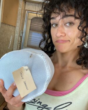 Katy O'Brian Instagram - Side boob. Tiny laundry basket. Baby Hei Hei