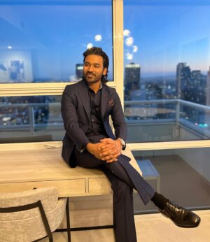Kavya Sriram Instagram - Styled @dhanushkraja Sir for the Grayman promotions in custom @raghavendra.rathore 🤍
Shoes @ferragamo 
Wrist piece - @omega 
Pocket square - @canali 
#thegrayman #styling #promotions 
@therussobrothers @chrisevans @ryangosling

Assisted by - @by_sarana 
Hair and grooming by @colleendominique