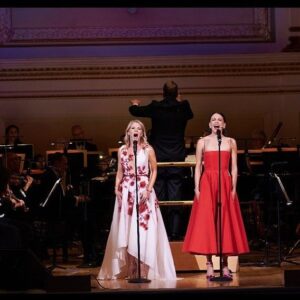 Kelli O'Hara Instagram - #photodump. I’m still misty about this past Friday night with my “partner in crime” @suttonlenore and our evening with @thenewyorkpops led by Maestro @stevenreineke @carnegiehall . There are so many people who made such a grand experiment come off without a hitch, so I must thank them! First of all, the 2 women who inspired the evening (and joined us via
voiceover🥹 ) #dameJulieAndrews and #carolburnett
❤ ❤ . We had wonderful writing and direction by #DickScanlan and additional writing by @katecjames . Our choreographer was the badass @edsciotto and we shared the stage with him and 3 more fabulous friends @ericamansfieldny @sherissespringer and @mrawayne. My right hand man @liptongram was ever by my side as was the incredible #MichaelRafter. It took so much incredible work by folks like our line producer @nikki_fergie and associate director @meganefarley, our orchestrators and everyone @thenewyorkpops to make this happen. I am forever grateful. I also want to thank our stylist @emilysanchezstyle for our #lewks with a huge shout out to @lindsayblockstyle and
@jilloshrymakeup for my #hmu👏 .

My looks in order of appearance:

Opening Dress: @randirahm
Shoes: @stuartweitzman
Bracelet: @Mariajosejewelry
Rings: @shopmodernmoghul

Pink gown with flowers: @Marchesafashion
Shoes: @ninashoes
Rings: @shopmodernmoghul, @itajewelry
Bracelet: @Nadrijewelry

Cowboy look 
Jeans: @everlane 
Shirt: @wrangler 
Boots: Crown vintage co @dsw

Red cocktail dress: @michaelkors
Shoes: @Sam_edelman
Bracelets: @Grownbrilliance, @Aliweissjewelry
Rings: @shopmodernmoghul, @itajewelry 
Earrings: @shopmodernmoghul

Suit: @michaelkors
Shoes: @ninashoes
Rings: @Grownbrilliance
Necklace: @Mariajosejewelry
Earrings: @Nadrijewelry