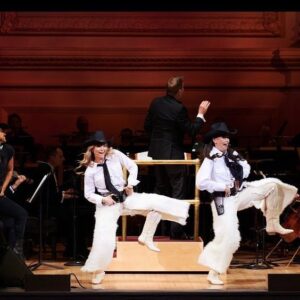 Kelli O'Hara Instagram - #photodump. I’m still misty about this past Friday night with my “partner in crime” @suttonlenore and our evening with @thenewyorkpops led by Maestro @stevenreineke @carnegiehall . There are so many people who made such a grand experiment come off without a hitch, so I must thank them! First of all, the 2 women who inspired the evening (and joined us via
voiceover🥹 ) #dameJulieAndrews and #carolburnett
❤ ❤ . We had wonderful writing and direction by #DickScanlan and additional writing by @katecjames . Our choreographer was the badass @edsciotto and we shared the stage with him and 3 more fabulous friends @ericamansfieldny @sherissespringer and @mrawayne. My right hand man @liptongram was ever by my side as was the incredible #MichaelRafter. It took so much incredible work by folks like our line producer @nikki_fergie and associate director @meganefarley, our orchestrators and everyone @thenewyorkpops to make this happen. I am forever grateful. I also want to thank our stylist @emilysanchezstyle for our #lewks with a huge shout out to @lindsayblockstyle and
@jilloshrymakeup for my #hmu👏 .

My looks in order of appearance:

Opening Dress: @randirahm
Shoes: @stuartweitzman
Bracelet: @Mariajosejewelry
Rings: @shopmodernmoghul

Pink gown with flowers: @Marchesafashion
Shoes: @ninashoes
Rings: @shopmodernmoghul, @itajewelry
Bracelet: @Nadrijewelry

Cowboy look 
Jeans: @everlane 
Shirt: @wrangler 
Boots: Crown vintage co @dsw

Red cocktail dress: @michaelkors
Shoes: @Sam_edelman
Bracelets: @Grownbrilliance, @Aliweissjewelry
Rings: @shopmodernmoghul, @itajewelry 
Earrings: @shopmodernmoghul

Suit: @michaelkors
Shoes: @ninashoes
Rings: @Grownbrilliance
Necklace: @Mariajosejewelry
Earrings: @Nadrijewelry