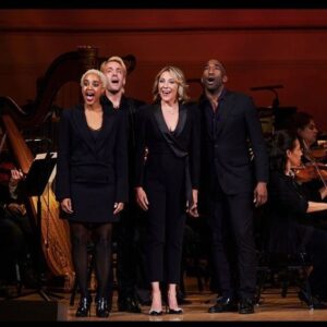 Kelli O'Hara Instagram - #photodump. I’m still misty about this past Friday night with my “partner in crime” @suttonlenore and our evening with @thenewyorkpops led by Maestro @stevenreineke @carnegiehall . There are so many people who made such a grand experiment come off without a hitch, so I must thank them! First of all, the 2 women who inspired the evening (and joined us via
voiceover🥹 ) #dameJulieAndrews and #carolburnett
❤ ❤ . We had wonderful writing and direction by #DickScanlan and additional writing by @katecjames . Our choreographer was the badass @edsciotto and we shared the stage with him and 3 more fabulous friends @ericamansfieldny @sherissespringer and @mrawayne. My right hand man @liptongram was ever by my side as was the incredible #MichaelRafter. It took so much incredible work by folks like our line producer @nikki_fergie and associate director @meganefarley, our orchestrators and everyone @thenewyorkpops to make this happen. I am forever grateful. I also want to thank our stylist @emilysanchezstyle for our #lewks with a huge shout out to @lindsayblockstyle and
@jilloshrymakeup for my #hmu👏 .

My looks in order of appearance:

Opening Dress: @randirahm
Shoes: @stuartweitzman
Bracelet: @Mariajosejewelry
Rings: @shopmodernmoghul

Pink gown with flowers: @Marchesafashion
Shoes: @ninashoes
Rings: @shopmodernmoghul, @itajewelry
Bracelet: @Nadrijewelry

Cowboy look 
Jeans: @everlane 
Shirt: @wrangler 
Boots: Crown vintage co @dsw

Red cocktail dress: @michaelkors
Shoes: @Sam_edelman
Bracelets: @Grownbrilliance, @Aliweissjewelry
Rings: @shopmodernmoghul, @itajewelry 
Earrings: @shopmodernmoghul

Suit: @michaelkors
Shoes: @ninashoes
Rings: @Grownbrilliance
Necklace: @Mariajosejewelry
Earrings: @Nadrijewelry