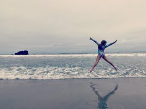Kelly Overton Instagram - The beach is open! We are a beach going family and have missed it so much. Yesterday was my 9 month old sons first time & my 9 year old daughter (pictured) didn’t care how cold the water was...she was IN! 💙🌊🦀 Thankful for this moment and that we’re able to relax on the beach once again. 🙏🏼