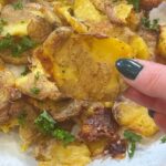 Kelly Kruger Instagram - CRISPY SMASHED SALT & VINEGAR POTATOES 🥔 Is it a Canadian thing? We put vinegar on our fries in Canada but maybe just a Quebec thing? Somebody help me with this. Are u making this? Ingredients: - Yukon Gold mini potatoes - Olive oil - Salt - Malt vinegar Instructions: 1. Preheat your oven to 450 2. Place the mini potatoes in a large pot and cover them with cold, salted water. Bring to a boil and cook until the potatoes are tender but still firm, about 15-20 minutes. 3. Drain the potatoes and let them cool and dry them as best as possible (I let mine sit for about 30 min) 4. Drizzle a baking sheet with olive oil. Place the potatoes on the baking sheet and, using a potato masher or the bottom of a glass, gently press down on each potato until it is about ½ inch thick. 5. Drizzle a little more olive oil over the smashed potatoes or spray them with either avocado or olive oil then sprinkle them with salt. 6. Roast the potatoes in the preheated oven for 20-25 minutes, or until they are crispy and golden brown. 7. Remove the potatoes from the oven and transfer them to a serving platter. Drizzle with malt vinegar and sprinkle with additional salt if desired. #potatoes #easyrecipe #recipeoftheday #glutenfree #frenchfries