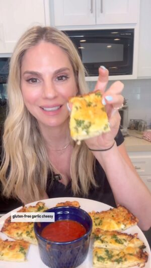 Kelly Kruger Instagram - GLUTEN FREE CAULIFLOWER CHEESY BREAD 🍞 🧀 

You would never know this is cauliflower!! 

Who’s making this? My kids finished this off so quickly.

Ingredients:
- 1 Bag Frozen Riced Cauliflower
- 3 oz Part Skim Mozzarella
- 0.75 oz Parmesan Cheese
- 1 Large Egg
- 2 Cloves Garlic, minced
- Sea Salt
- Black Pepper
- Oregano
- 1.5 oz Part Skim Mozzarella (for toppings)

Instructions:
1. Preheat your oven to 425
2. Cook the frozen riced cauliflower according to the package instructions. Once cooked, place the cauliflower in a clean kitchen towel and squeeze out excess moisture.
3. In a mixing bowl, combine the squeezed cauliflower, 3 oz of Part Skim Mozzarella, 0.75 oz of Parmesan Cheese, 1 large egg, minced garlic, a pinch of sea salt, black pepper to taste, and a sprinkle of oregano. Mix until well combined.
4. Line a baking sheet with parchment paper and spread the cauliflower mixture into a rectangle or circle, about 1/4 inch thick.
5. Bake in the preheated oven for about 20 minutes or until the crust is firm and lightly browned.
6. Remove from the oven and sprinkle 1.5 oz of Part Skim Mozzarella on top. Return to the oven and bake for an additional 5-10 minutes, or until the cheese is melted and bubbly.
7. Once done, remove from the oven and let it cool slightly before slicing into pieces.
8. Serve your Garlic Cheesy Bread warm and enjoy!

#cauliflower #cheesybread #cheese #bread #keto #glutenfree #easyrecipes #comfortfood #eeeeeats #yum