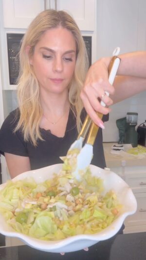 Kelly Kruger Instagram - Easy Chopped Salad 🥗 

You can really do any combination of veggies and protein and never go wrong with a chopped salad. We love this one and we have it at least once a week over here. 

Ingredients:
- 1 head of iceberg lettuce, chopped
- 1 cucumber, diced
- 1 can of garbanzo beans, rinsed and drained
- 1 can of hearts of palm, drained and sliced
- 1/2 cup of olives, sliced
- 1 cup of mozzarella cheese, cubed
- 1 cup of diced turkey breast
- 1/4 cup of pepperoncini, sliced

For the dressing:
- 1/4 cup of olive oil
- 2 tablespoons of red wine vinegar
- 1 tablespoon of Dijon mustard
- Salt to taste
- Grated Parmesan cheese for topping

Will you be making this? 

#salad #veggies #choppedsalad #easyrecipe #quickdinner #vegetables #protein