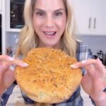 Kelly Kruger Instagram - I finally did it! After 4 tries I MADE A GLUTEN FREE ARTISAN BREAD!🥖 It’s not like my high protein bread. The texture is like bread bread. Who’s trying this? Or just easier to buy it? Ingredients: - 3 cups gluten-free all-purpose flour - 1 teaspoon salt - 1 teaspoon instant yeast - 1 1/2 cups warm water - 1 tablespoon honey (optional, for a touch of sweetness) - 1 tablespoon olive oil - Additional flour or cornmeal for dusting Seasoning like everything but the bagel Instructions: 1. In a large mixing bowl, combine the gluten-free all-purpose flour, salt, and instant yeast. 2. In a separate bowl, mix the warm water and honey (if using) until the honey is dissolved. 3. Gradually pour the wet ingredients into the dry ingredients, stirring as you pour. Mix until well combined. The dough will be sticky and wet. 4. Cover the bowl with plastic wrap and let it sit at room temperature for about 1-2 hours, or until the dough has risen and has a few bubbles on the surface. The rising time may vary depending on the temperature in your kitchen. 5. Preheat your oven to 450°F (230°C). Place a Dutch oven or a heavy oven-safe pot with a lid into the oven as it preheats. 6. Once the oven and pot are preheated, carefully remove the pot from the oven. Sprinkle a little flour or cornmeal on the bottom of the pot to prevent sticking. 7. Scrape the gluten-free bread dough from the bowl onto a piece of parchment paper. Shape the dough into a round loaf, using wet hands to prevent sticking. Place the parchment paper with the dough into the preheated pot. Top with seasoning of choice. I did everything but the bagel. 8. Cover the pot with the lid and bake for 30 minutes. Then, remove the lid and continue baking for an additional 10-15 minutes, or until the bread is golden brown. 9. Once the bread is baked, carefully remove the pot from the oven and transfer the bread to a wire rack to cool. #bread #glutenfree #glutenfreebread #recipe #recipepftheday #homecooking