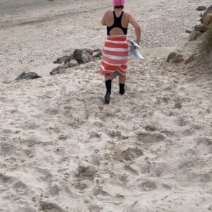 Kitty Flanagan Instagram - Testing the waters in Adelaide at Henley Beach. Turns out you can swim anywhere as long as you’re prepared to look like a tit! #winterwarriers @brightonbathshealthclub