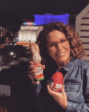 Kitty Flanagan Instagram - Hi Junkees fans, no new ep today cos Dave & I are at opposite ends of the country. (Keen eyes will spot the gorgeous @empire_theatre in Toowoomba in the background - yes I finally got there!) But I’m here today with an urgent Junkees PSA - only one week left to get yourself a Rocklea Road Easter egg. So good - like a top shelf Golden Rough with bits of marshmallow in it. Just get one! #junkees #darrelllea #jesusloveschocolate