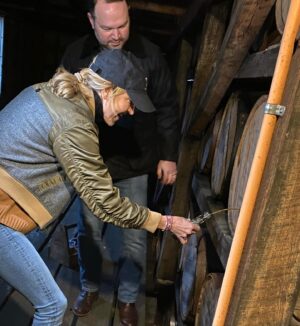 Lara Spencer Instagram - 10 shots (pun intended) of our Mother Son tour of Jack Daniel's Distillery.  A fabulous history lesson and look at how this iconic American brand takes such pride in their product.  Did you know every drop of Jack around the world is made right here in Lynchburg, TN?  Handcrafted right down to the labels-- applied by HAND (see the video attached--I kept thinking of Lucy and the chocolates!). What a highlight to do a tasting with the Master Distiller and true rockstar Chris Fletcher and go up to the top floor of a very special barrel house, watch him DRILL into a barrel of 4 year old Tennessee Whiskey, and  allow us to fill a bottle and taste.  Learned so much.  Laughed so much.  Hopefully our boys will smile and remember our day every time they see a bottle of Jack.  #oldnumber7 .