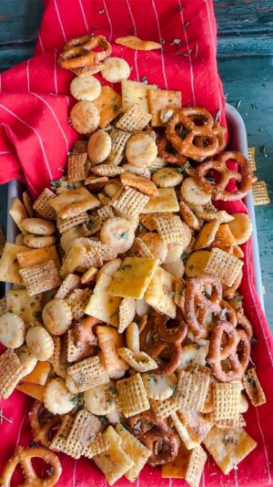 Laura Vitale Instagram - A party in your mouth!! So good you’re gona love itttt!!!! Listed ingredients below! 
10 cups of assorted crackers/cereal/pretzels of choice 
8tbsp of melted butter 
1.5 tbsp of Worcestershire sauce 
2 tbsp of granulated garlic
2 tsp of granulated onion
Paprika for color
Seasoned salt to taste 
Parsley to taste