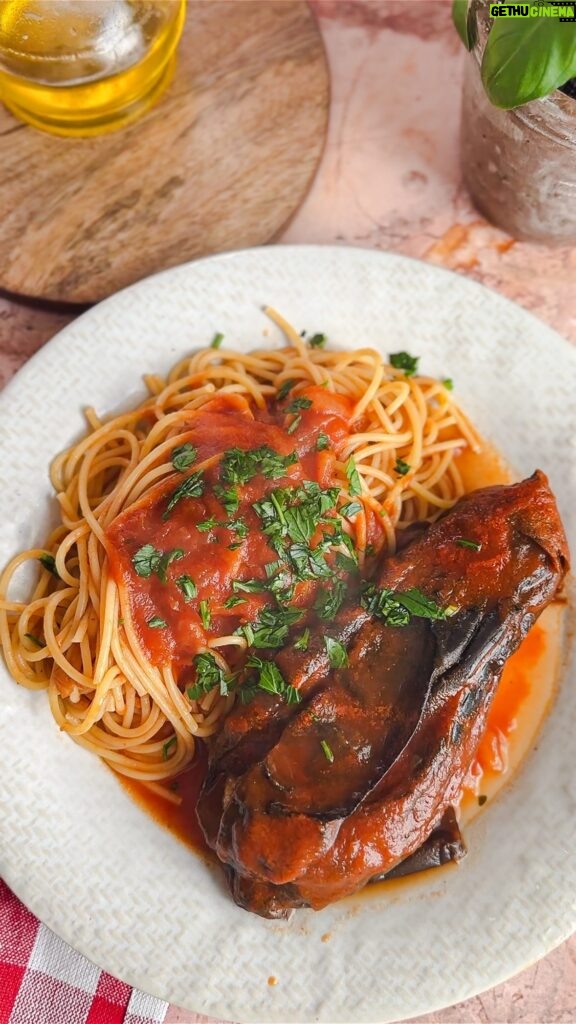 Laura Vitale Instagram - Good ole Italian cooking from the heart is everything!! I stuffed whole eggplant (get small ones for this!) with lots of garlic, parsley and cheese, then simmered in a lovely sugo for a couple hours. It’s like a vegetarian version of bracioletti I kid you not! Joe was convinced the inside was stuffed with meat 🤣 he didn’t believe me when I told him it was just the flesh of the eggplant that soaked up all that beautiful flavor and got all rich and delish throughout the cooking process. I wanted to add a handful of golden raisins (just like Nonna does in bracioletti which by the way the recipe for those are in my book!) but was fresh out of those. So sensational, I can’t wait to make this again and again with our garden fresh eggplants soon! No real recipe I just cooked from the heart!