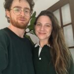 Lauren Collins Instagram - Reposting @jonathanmalen to show us in our most natural state. Him - wearing my cast sweatshirt from a 1997 community theatre production of Lillian Hellman’s “The Children’s Hour”. And me - wearing the men’s Zara shirt I bought him for Chanukah, smiling through the inevitable fate of being forced to finally watch Cast Away for the first time. Bonus swipe for Charlie in his most natural state eating crackers, oblivious to it all. #happyholidays folks