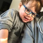 Lauren Collins Instagram - Tips for toddlers wearing glasses if you’ve got ‘em! A few months ago we realized Charlie’s left eye wasn’t aligning properly. After confirming he has strabismus (lazy eye!) I was shocked to find out he would need to start wearing glasses immediately ALL THE TIME. Like… how was that going to work? He won’t even wear pants most of the time. One week in and he’s already a pro. I’m constantly amazed by how adaptable these little ones are. It’s gonna be a long road ahead of patching and possible surgery but I’m so proud of our little Charlie Lipnicki. “Did you know the human head weighs eight pounds?” ❤️❤️❤️