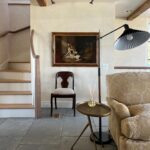 Lauren Liess Instagram - New stairs who dis 🤎 {swipe for before} Our clients wanted to make their outdated family room-kitchen addition feel as timeless and true as the rest of their historical home to get it truly functional for their horse-loving family. A soft palette of bluestone floors, creamy plaster walls, antique beams, and grays & camel tones along with time-tested furnishings and architectural details (I have had a similar inspiration stair railing pinned for so many years and was so excited to finally get to use that baby!!) completely transformed the space. We’re so thankful to our clients for their trust and to the amazing team we got to work with! 🤎🐴 Interior Design by @laurenliessandco Architecture by @sutphin_architecture Renovation by @casecohomes Sofa is the “Libris” in the softest camel damask from my collection with @taylorkingfurniture