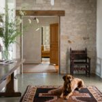 Lauren Liess Instagram - One of my favorite spaces we’ve ever done ~ the foyer in our #wisconsinfarmhouse project 🤍 vintage antiques a “metamorphosis” foyer console that can transform into a full dining table when needed for carryover dining (it’s the opposite of a drop leaf and is from my collection with @woodbridgefurniture ) 🤍🌿 photo by @helennorman | designed by us @laurenliessandco {we get asked all the time if we are taking in new projects and travel and the answer is yes and yes! We’re always looking to work with clients who share our love for nature, real humble materials, and down to earth, soulful living and need their homes designed 🤍 Over half of our projects are out of state 🤍)