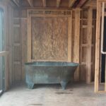 Lauren Liess Instagram - The CORRECT 200-something-year-old tub has arrived at the Meadow!! 🛁And it is green!! (Phew!!) I’ve been going back and forth internally on its positioning… I have always planned for it to span left-to-right in front of the back window (1st video/ 2nd slide) but can’t forget how much I loved baths in our old tub which faced straight out out a (side) window so I’ve been wrestling with facing it towards the back window (3rd 4th slides). The glass door to the left side will lead to a walled-in garden with outdoor showers in it and the back window (not in yet) looks out to the back yard. I love the silhouette of the tub when it’s sideways and space-wise it fits the room perfectly but I can’t unsee the thought of those facing those views straight on. Here it is both ways and I’m 99.9% on team facing the views now. It somehow feels more authentic to me, having the tub face the way we will naturally want to look but I’m a little sad to see less of the tub straight on and I don’t love having my back to the room. Something I’ve written a bit about in the past is that there are some spaces where the “enjoyment” arrangement (the one you will be using and enjoying while in the space) isn’t as pretty upon entry or to look at… in these cases I think about pros and cons (enjoyment in the room usually wins unless it’s just way too awkward-feeling.) I’ll be posting a video update of our final decision once it’s made… what would you do?? Are you on Team sideways or Team Views?? 🫧 {Also, if you haven’t seen it, our first Meadow House episode is up on y o u. T ube!