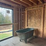 Lauren Liess Instagram - The CORRECT 200-something-year-old tub has arrived at the Meadow!! 🛁And it is green!! (Phew!!) I’ve been going back and forth internally on its positioning… I have always planned for it to span left-to-right in front of the back window (1st video/ 2nd slide) but can’t forget how much I loved baths in our old tub which faced straight out out a (side) window so I’ve been wrestling with facing it towards the back window (3rd 4th slides). The glass door to the left side will lead to a walled-in garden with outdoor showers in it and the back window (not in yet) looks out to the back yard. I love the silhouette of the tub when it’s sideways and space-wise it fits the room perfectly but I can’t unsee the thought of those facing those views straight on. Here it is both ways and I’m 99.9% on team facing the views now. It somehow feels more authentic to me, having the tub face the way we will naturally want to look but I’m a little sad to see less of the tub straight on and I don’t love having my back to the room. Something I’ve written a bit about in the past is that there are some spaces where the “enjoyment” arrangement (the one you will be using and enjoying while in the space) isn’t as pretty upon entry or to look at… in these cases I think about pros and cons (enjoyment in the room usually wins unless it’s just way too awkward-feeling.) I’ll be posting a video update of our final decision once it’s made… what would you do?? Are you on Team sideways or Team Views?? 🫧 {Also, if you haven’t seen it, our first Meadow House episode is up on y o u. T ube!