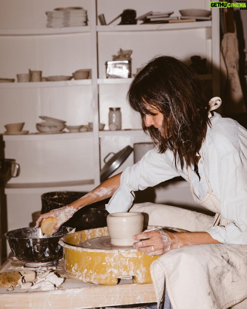 Leanne Ford Instagram - My most personal addition to this collection has got to be the Kiln Dinnerware Set — prototyped by yours truly in my very own ceramic studio (basement!) I by no means am a “true” ceramicist but I love to play on the wheel and with different glazes and forms. I basically hacked the system by convincing @crateandbarrel let me produce these pieces at scale in Portugal! For months I sat at the wheel and created version after version until I got it just right (perfectly wonky — just the way I like it) and then I would carefully pack that little prototype up and ship it off to the @crateandbarrel headquarters and they would take it from there. // #LeanneForCrate shot by @amyneunsingerwith interior styling by @hilaryrobertson — Studio shoot shot by @sarahbarlow for @feelfree