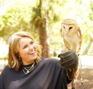 Lee Newton Instagram - Was I 💯 convinced that this Hawk was a human man trapped in a bird body and needed me to break his bird curse with a smooch. Yes. Can you see the palpable sexual tension betwixt the two of us in these photos- UHHH, YES. Thank you @hawkonhand for introducing us, and for such an educational, delightful time! (Legitimately if you’re in the LA  area this was such an INCREDIBLE EXPERIENCE!!! Do it!!!) 
Ps. The owls name is Archie 🥹🦉!!!