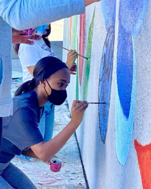 Lidya Jewett Instagram - helping put a library where there was none. 9000 books and beautiful murals. so so excited for the students at @cechs.asb in Compton.