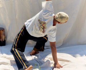 Lily Sullivan Instagram - Always up for supporting what @ellanoahbancroft_ is shaping in this world, this baddass boss babe and my long time sister has teamed up with the crew at @nagnata_ - a brand with an ethos of integrity and collaborating with local First Nations movements. 
The Tee features hand painted artwork and poem by artist @amarina.toby illustrating her connection to country. 

100% of the profits goes towards @the_returning_ founded by @ellanoahbancroft_ a Not-for-profit indigenous owned and run charity. 
Go buy one 😉

@nagnata_
@ellanoahbancroft_
@the_returning_
Artist @amarina.toby
Photographer @avanpodhajsky