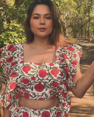 Lin Laishram Instagram - “And the pomegranates split and cracked with the heat, and showed the bleeding red hearts.”
- Oscar Wilde
Pomegranate dress by @truffle_india 
@tajsafaris
Jewelry @shamooosana
