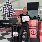 Lindsay Czarniak Instagram – This one really made me laugh out loud. I love when makeup and racing intersect! And thanks @katherineracing for being a good sport during the 4 hour rain delay. (Swipe for bonus answer pic bc I love a checkered flag:) #JOTD #indycar #makeup #lipstick #duck #racing #girlsinsports #girlpower
