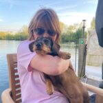 Lorraine Kelly Instagram - Love our wee @rubyisasausage - a lovely sunny evening - and lots of cuddles #sausagedog #cute #cuddles #love