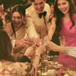 Louisa Mak Instagram - 唔少朋友都問我，哇搞三場婚禮，咪好辛苦！的確係，完事後直情要瞓足成個禮拜先recover到。其實唔係因為想搞到好「盛」大，而係源自於一個儘量make everyone happy嘅初心。 由於我和盛生好怕衝突、唔開心，所以我哋好早就決定將婚禮分幾次搞，而每一場都有各自嘅主角。大大小小嘅選擇就因住主角嘅需求而決定。 第一場盆菜宴，主角係老爺奶奶。我地盡跟圍村傳統，賓客絕大部份都係佢哋嘅親戚和朋友，而表演嘉賓方面，就邀請了奶奶很喜愛嘅李龍基先生。 第二場係正常擺酒，主角就係麥生麥太，菜式、流程、程序等都以佢地嘅意見為首。圍數全部歸佢地兩老，只受場地所限而唔使同對家協調😌 婚紗款色都迎合佢地喜好 至於第三場，就係更瘋狂嘅party，主角終於係我同盛生喇✌️因為之前已經take care 咗雙方父母嘅要求，呢次我哋就可以盡情選擇自己鍾意嘅嘢 - 戶外草地、樂隊歌曲、西式食物、無限酒精🫢… 爸爸媽媽雖然唔識欣賞，但係都好盡力去嘗試投入 😂 呢個安排，幫我地避免咗唔少衝突。男女家唔使爭圍數、長輩和後輩唔使爭論食物和形式係中式定西式；頭兩場我和盛生安分守己地做好兒子和女兒的本分，再於尾場玩得好盡興🥳（盡興到啲相都唔出得街🤪)。咁壞處就係… 真係好攰🫠。 每人屋企都唔一樣，家家有本難念的經，以上純粹share下我倆嘅經驗。總括來講，我爸爸媽媽、老爺奶奶也是非常隨和，我們非常幸運，而最後似乎各人都開心。不過同時都提醒一句，家人話「冇咩所謂，簡簡單單就OK」呢句說話… ummm.. 千祈唔好盡信呀🤪唔知你哋又有冇啲咩婚禮後嘅insight呢？喺comment share吓吖！ 最後，多謝 @agnesb_cafefleuriste 為三場婚宴都提供無限量超好食蛋糕😌 無論喺中式定西式婚宴、男家定女家、長輩定小朋友，蛋糕都一樣咁受歡迎😍 #勁甜麥 photo 1, 2, 5, 8 @taptsov_photography photo 4 @orbsproductionwedding photo 6, 7, 9, 10 @stein_image