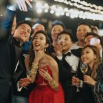 Louisa Mak Instagram - My favourite red 送客gown… that turns into a party dress!!!! 🤘 perfect with gold bangles from @lukfookjewellery_official #唔係假酒 #跟足傳統 🤪 💃#victorchanstudio @victorchanstudio Special thanks to @jamieleehair 醉住幫我換頭 📸 1, 2 @hoyin626 3 @taptsov_photography 4-7 @stein_image