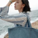 Louise Wong Instagram - Be your own sunshine☀️🌊🤍 @givenchy #givenchyplage #givenchyfamily