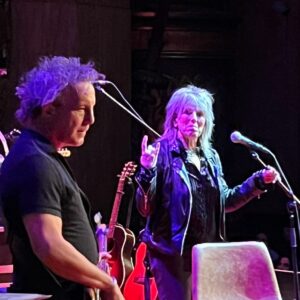Lucinda Williams Instagram - Whew! 2023 has been a blast. We rang in my 70th birthday playing a show in Belfast and celebrated with a surprise party back in the states with my friends. 

@americanafest “pre-Grammy salute” (which I was so excited to tune in via livestream as I was under the weather… but an honor, nonetheless!)

My memoir was released in April and hit the NYT bestseller list 🥲

Stories From a Rock N Roll Heart came out this summer ❤️‍🔥 and I am overwhelmed with the outpouring of love it’s been receiving.

We toured with our new friends @bigthiefmusic and had a blast when we got to share the stage 

Forbes included me in their 50 over 50 😅

Played guitar on stage at @theryman for the first time since my stroke in 2020 🙌🎸

Car Wheels hit its 25th anniversary and we had a great time at the tribute at @thebasementeast

And this was the year we introduced our new concert formatting for “Don’t Tell Anybody the Secrets” tour, where we incorporate more storytelling and visuals along with the songs. 

All in all, 2023 was an exciting year full of rock n roll throughout Australia, Mexico, Europe (twice) and all around the United States adding up to 200 days on the road. Watch out, 2024… we’re coming for you 😉